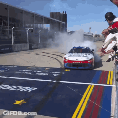 A Race Car With The Word Mobil On The Side Of It GIF