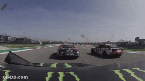 A Race Car With Toyota Written On The Side Of It GIF