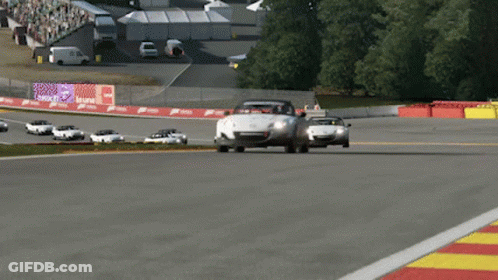 A Race Track With A Lot Of Cars And A Sign That Says ' Acura ' On It GIF