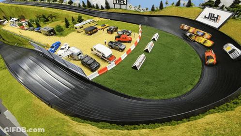 A Race Track With A Sign That Says Jlh GIF
