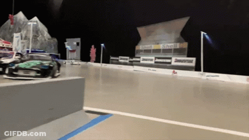 A Race Track With Shell And Bridgestone Signs On It GIF