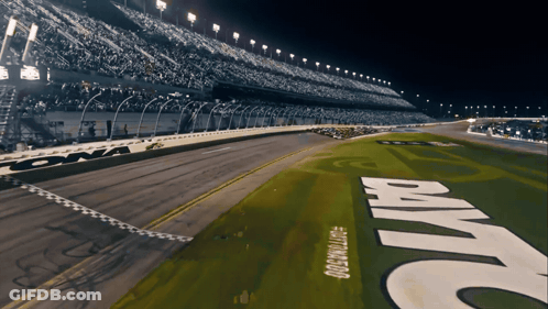 A Race Track With The Word Daytona On The Side GIF