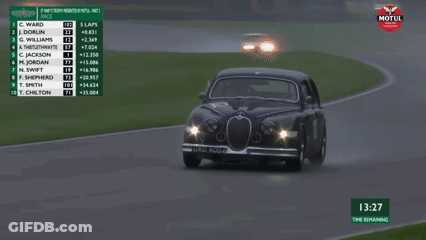 A Racing Car With The Number 102 On The Side GIF