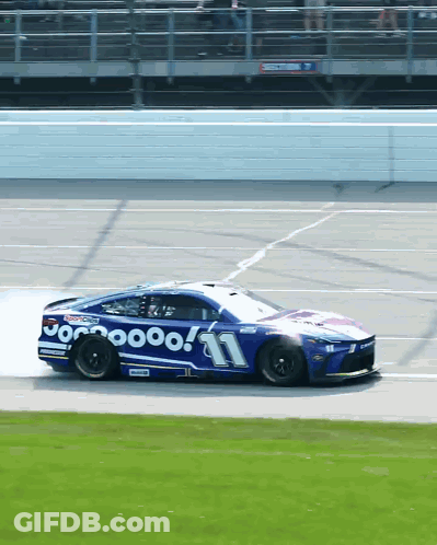 A Racing Car With The Number 11 On It GIF