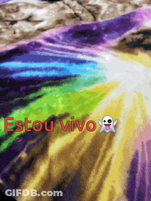 A Rainbow Colored Blanket With The Words Estou Vivo Written On It GIF