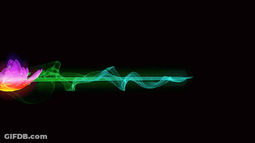 A Rainbow Colored Flower Is Surrounded By Green Smoke GIF