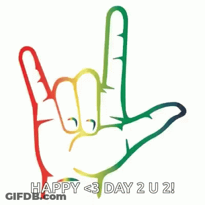 A Rainbow Colored Hand Is Making A Rock And Roll Sign . GIF