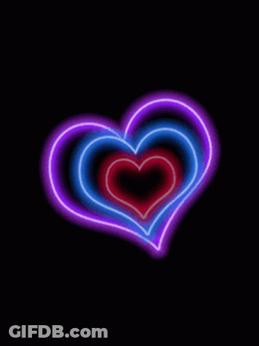 A Rainbow Colored Heart Is Surrounded By Other Rainbow Colored Hearts GIF