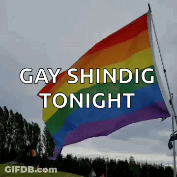 A Rainbow Flag Is Flying In The Wind With The Words Gay Shinig Tonight Above It GIF
