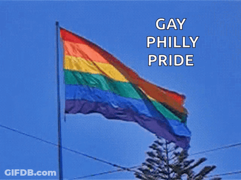 A Rainbow Flag With The Words Gay Philly Pride Written Above It GIF