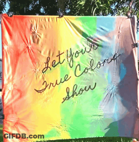 A Rainbow Flag With The Words " Let Your True Colors Show " Written On It GIF