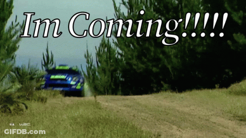 A Rally Car Is Driving Down A Dirt Road With The Words " Im Coming " Written Above It GIF