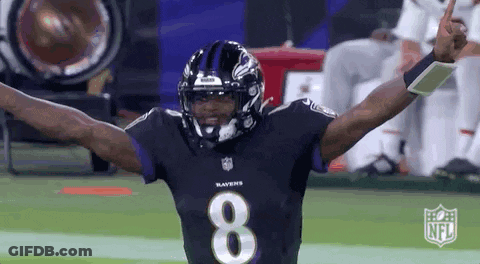 A Ravens Football Player Is Celebrating With His Arms Outstretched . GIF