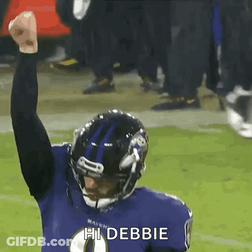 A Ravens Football Player Is Celebrating With His Fist In The Air And Says Hi Debbie GIF