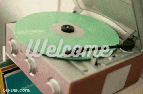 A Record Player With A Green Record On It Says Welcome GIF