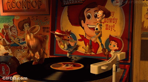 A Record Player With Woody And Buzz Lightyear Playing Roundup GIF