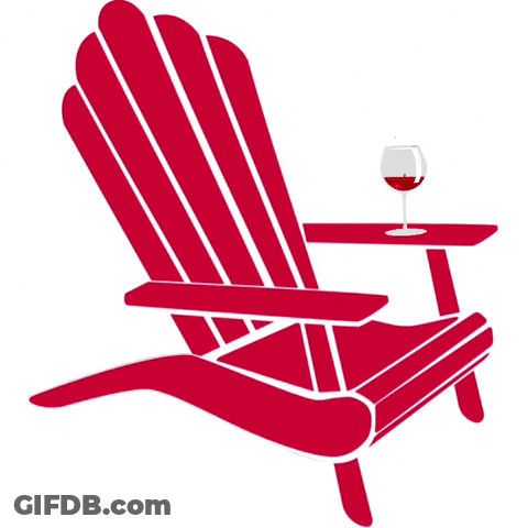 A Red Adirondack Chair With A Glass Of Wine On The Arm GIF