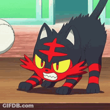 A Red And Black Cat Is Standing On A Wooden Table . GIF