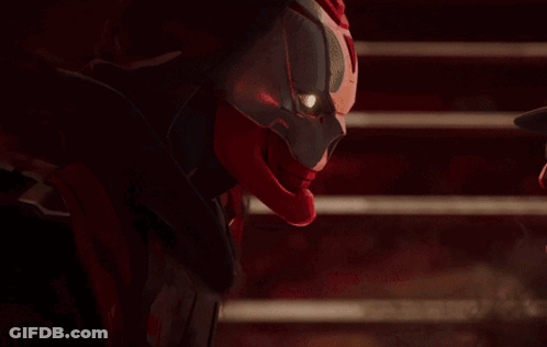 A Red And Black Superhero With A Red Helmet On GIF