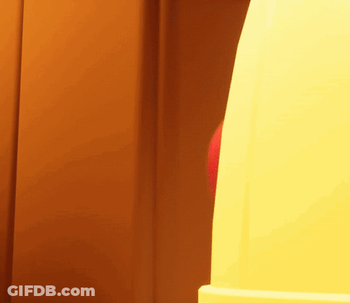 A Red And Blue Balloon Is Being Thrown Into A Yellow Object GIF