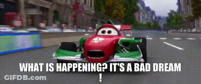 A Red And Green Race Car Is Driving Down A Street With The Words What Is Happening It 'S A Bad Dream . GIF