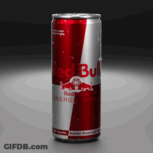 A Red And Silver Can Of Red Bull Energy Drink On A Black Background GIF