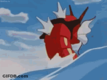 A Red And White Cartoon Character Is Swimming In The Ocean . GIF