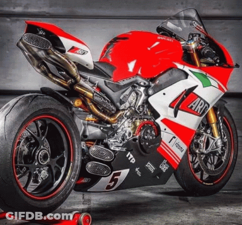 A Red And White Ducati Motorcycle With The Number 5 GIF