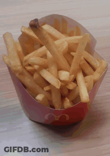 A Red And White Mcdonald 'S Container Of French Fries GIF