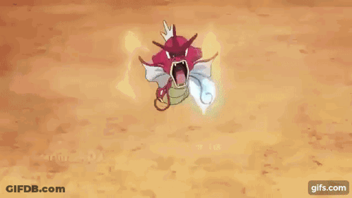 A Red And White Pokemon With Its Mouth Open Is Holding A Blue Flame In Its Mouth . GIF