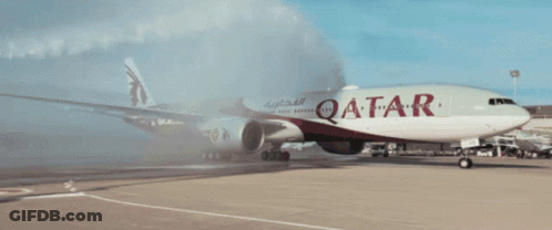 A Red And White Qatar Airplane Is Parked On The Runway GIF