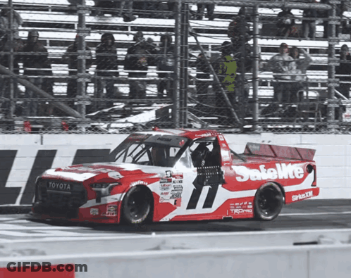 A Red And White Race Car That Says Safelite On The Side GIF