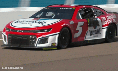 A Red And White Race Car With The Number 5 On The Side GIF