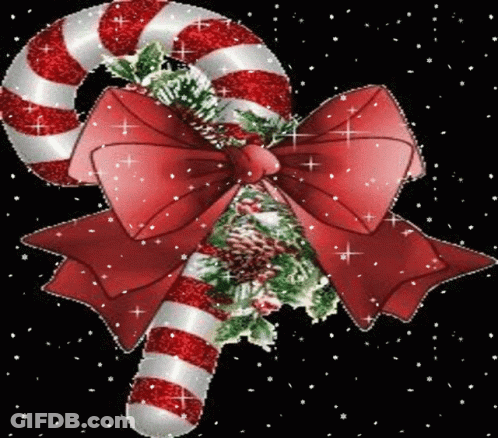 A Red And White Striped Candy Cane With A Red Bow GIF
