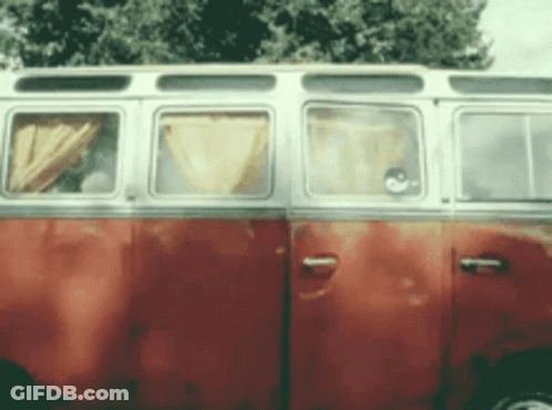 A Red And White Van Is Parked In Front Of A Tree GIF