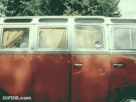 A Red And White Van With A Sticker On The Door That Says ' A ' GIF