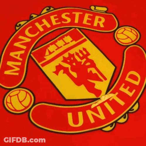 A Red And Yellow Manchester United Logo With A Finger Pointing At It GIF