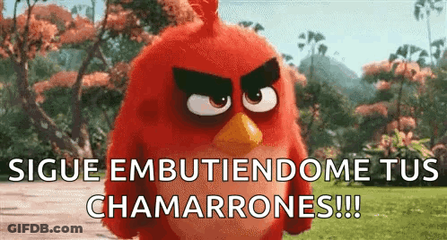A Red Angry Bird From The Angry Birds Movie Is Standing In A Field With Trees In The Background . GIF
