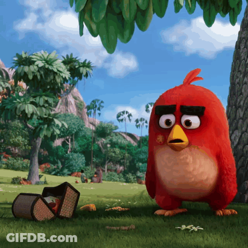 A Red Angry Bird Is Standing In The Grass GIF