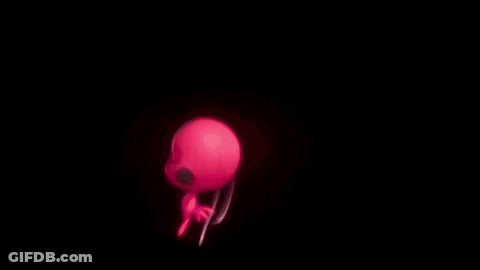 A Red Ant And A Black Cat Are Standing Next To Each Other In The Dark . GIF