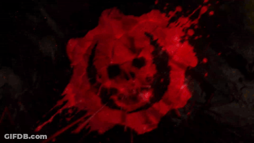 A Red Background With A Skull In The Middle Of It GIF