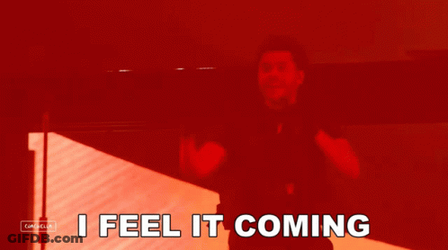 A Red Background With The Words I Feel It Coming In White GIF
