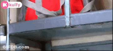 A Red Bag Is Hanging From A Metal Railing With A Kulfy Logo On The Bottom Right GIF