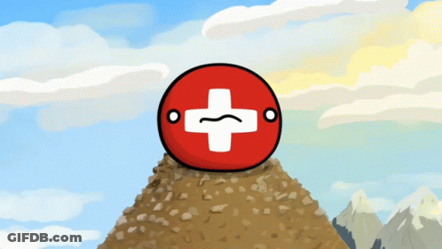 A Red Ball With A White Cross On It Is On Top Of A Rocky Hill GIF