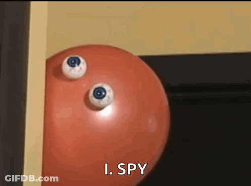 A Red Ball With Two Eyes On It And The Words I Spy Below It GIF