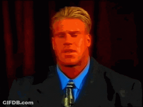 A Red Bodybuilder Is Flexing His Muscles In Front Of A Yellow Background GIF