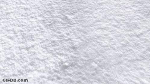 A Red Brick Is Laying On A Snowy Surface GIF