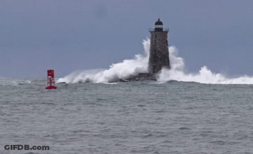 A Red Buoy With The Letter N On It Is In The Middle Of The Ocean Near A Lighthouse GIF