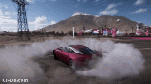 A Red Car Is Drifting On A Road With Smoke Coming Out Of The Tires GIF