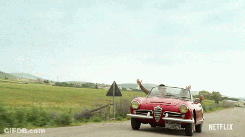 A Red Car Is Driving Down A Dirt Road With Netflix Written On The Bottom GIF
